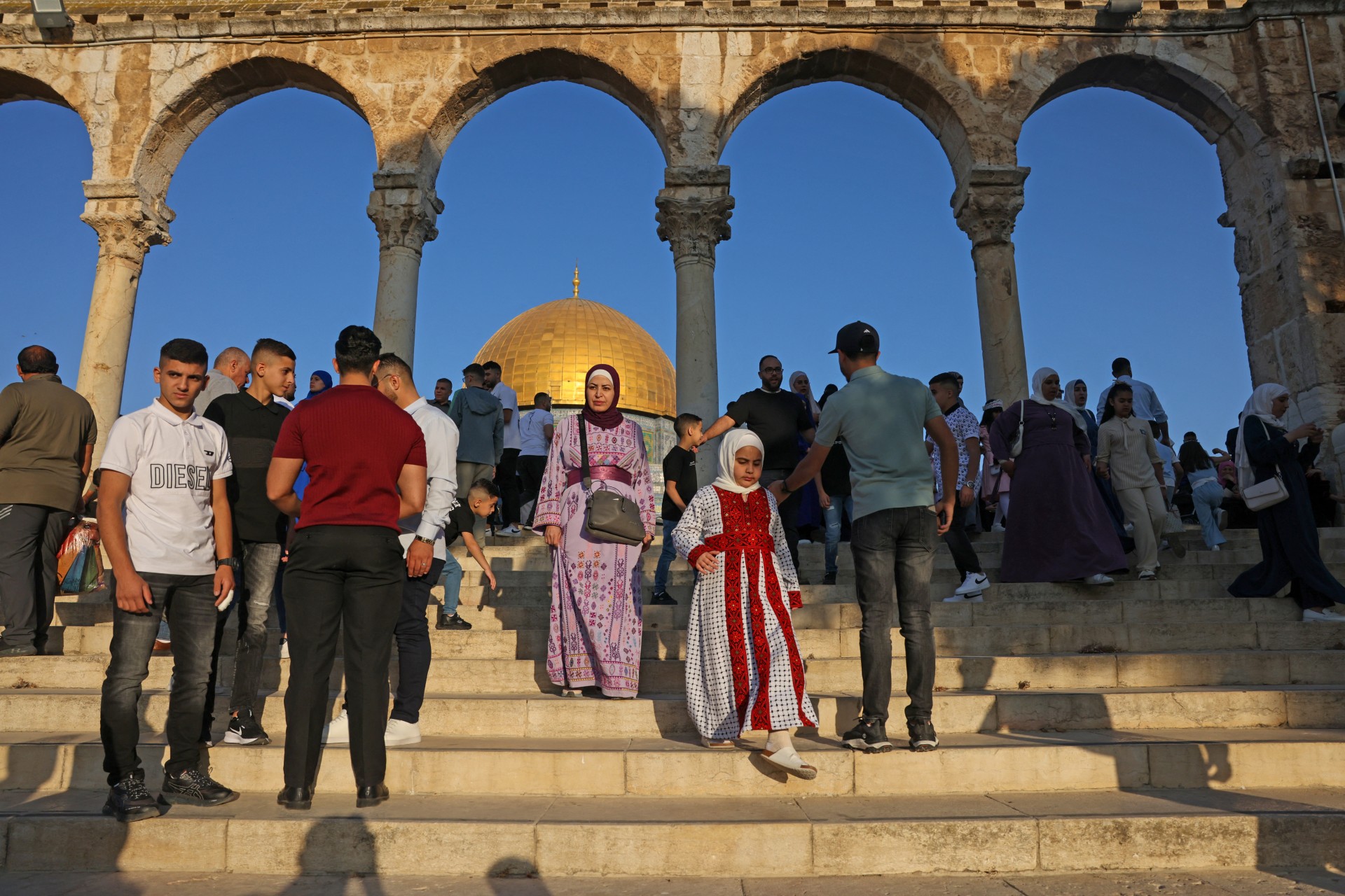 Palestinians gather near the Dome of the Rock, in the Al-Aqsa Mosque courtyards, on the first day of Eid al-Adha on 6 June 2025 (AFP/Ahmad Gharabli)