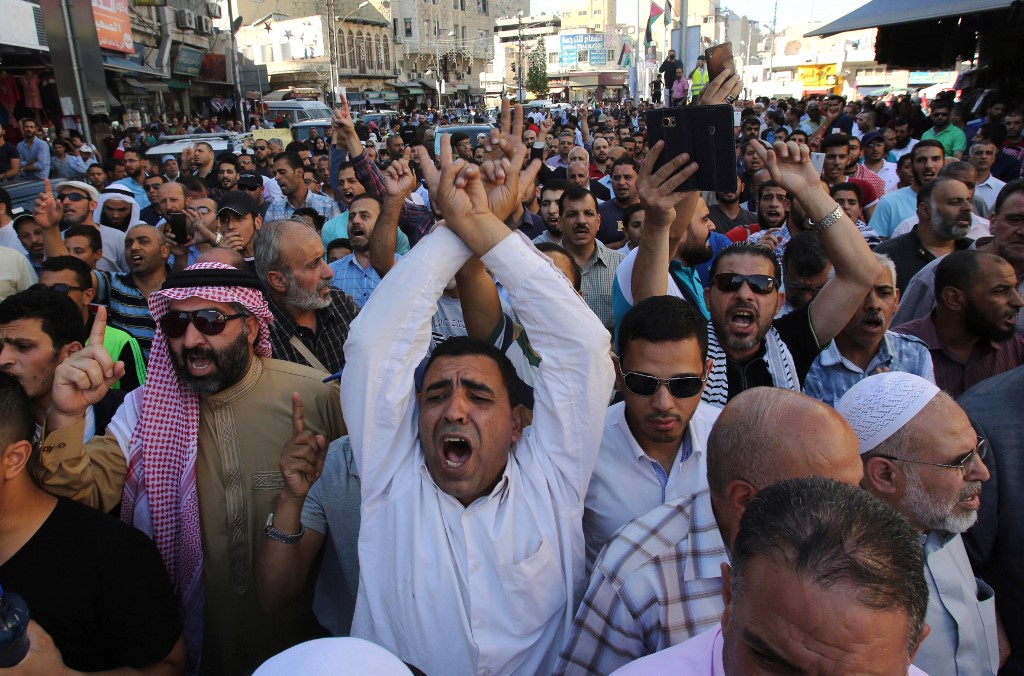 Protestors chant slogans in the Jordanian capital Amman on July 15, 2017 during a demonstration against the closure of the Al-Aqsa mosque compound in Jerusalem