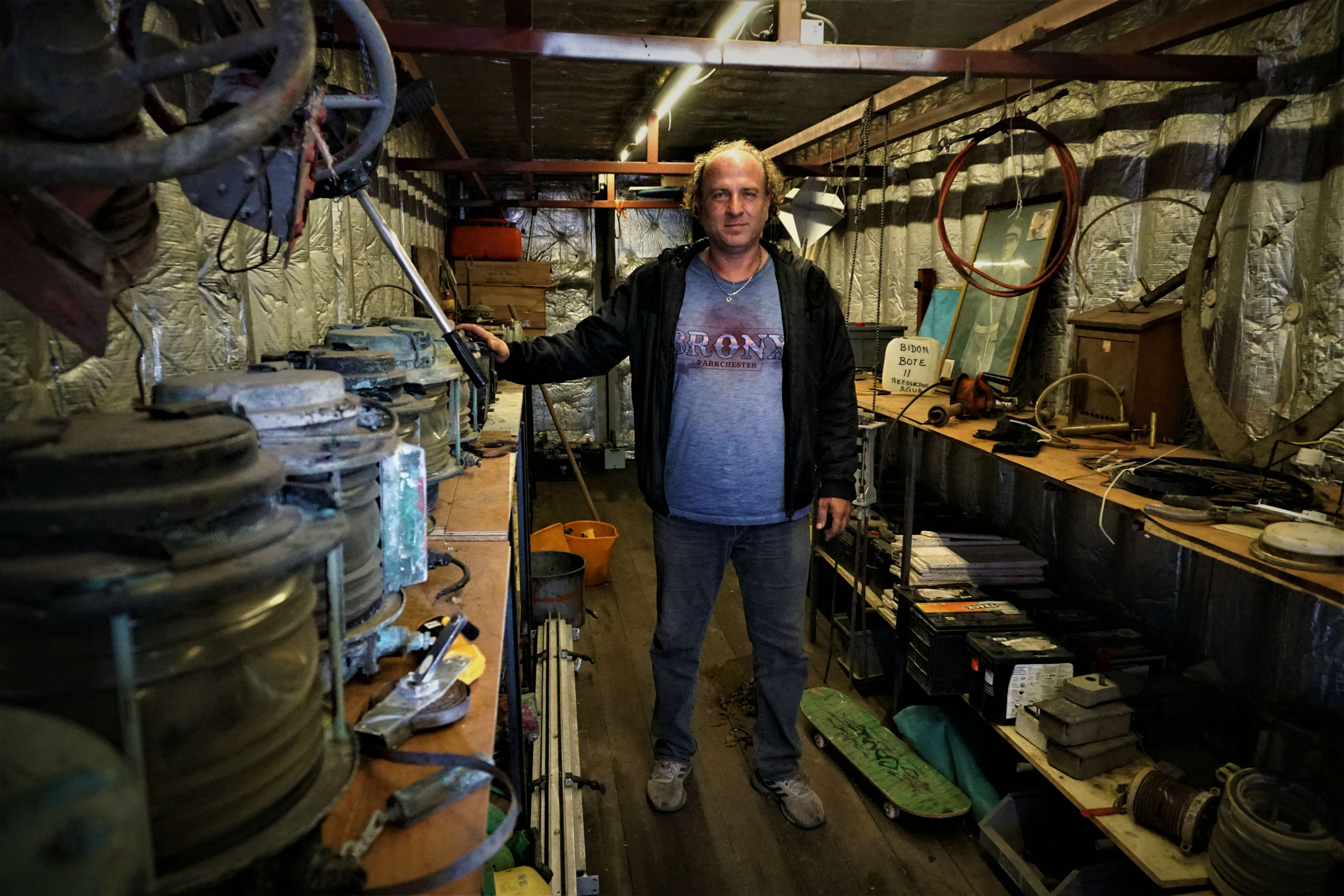 Antique dealer Selim Afacan submits bids for things he is interested in buying when a vessel arrives at the port (MEE/Nimet Kirac)