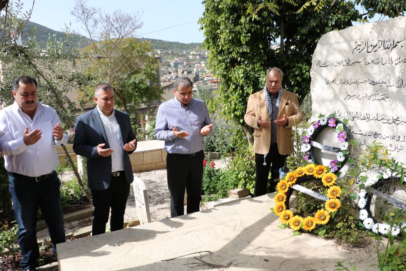 Palestinians inside Israel putting wreaths on the graves of the six Palestinians killed by Israeli forces on 30 March 1976 (Arab48)