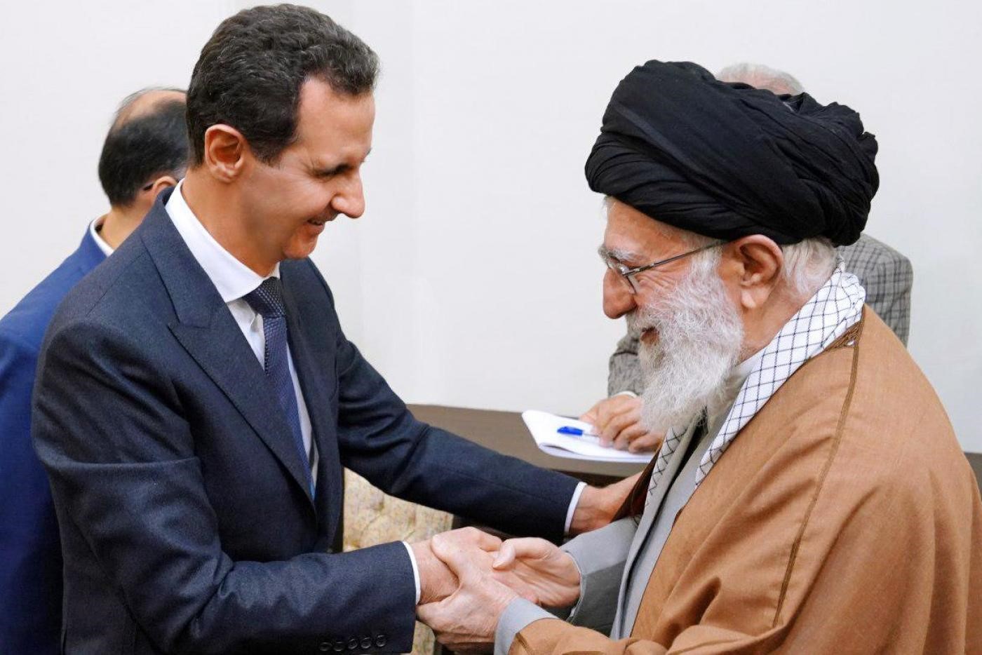 Supreme Leader Ali Khamenei greets Syrian President Bashar al-Assad (L) in Tehran on 25 February during a rare visit (AFP)