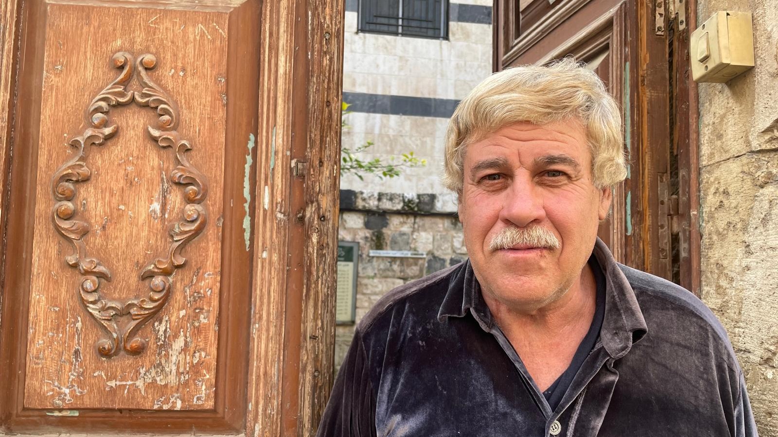 Mohammed Hisham Barazanko outside his studio in Hama (MEE/Daniel Hilton)