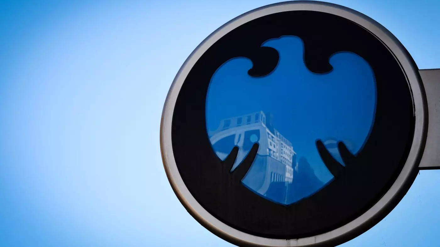 The Barclays Bank logo is seen on a sign outside the entrance to a branch of the bank in Bracknell town centre on 10 January (Adrian Dennis/AFP)