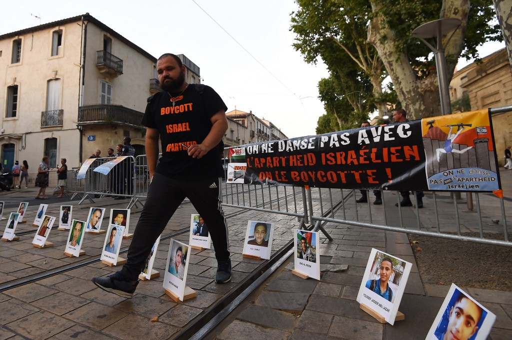 A man attends a BDS rally in southern France in June 2018 (AFP)