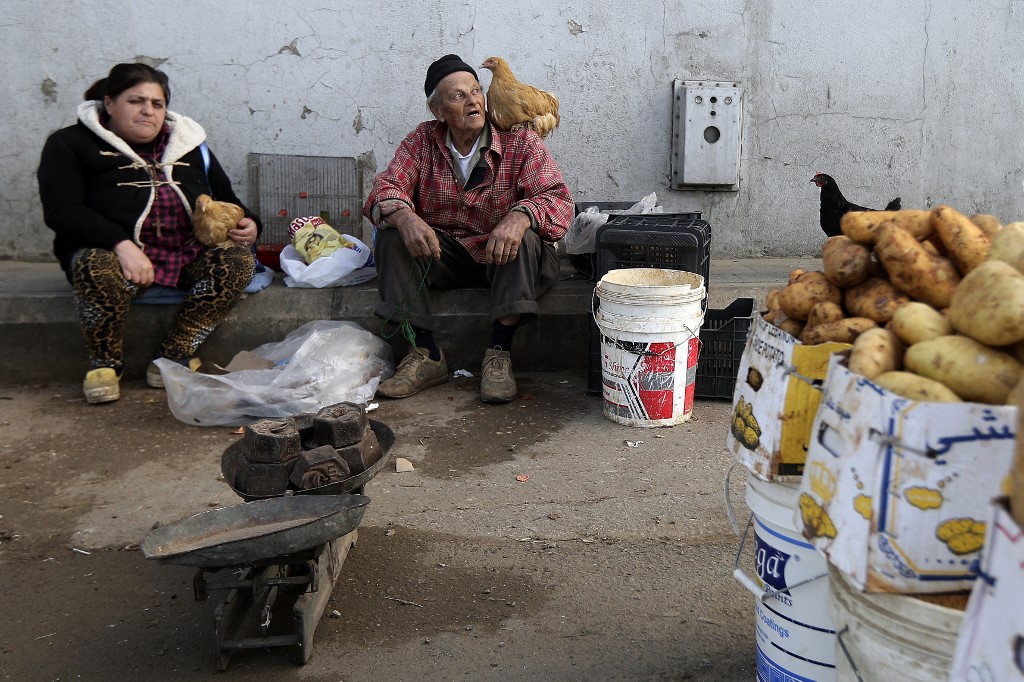 A Lebanese street vendor sells eggs and potatoes in Beirut in January 2018 (AFP)