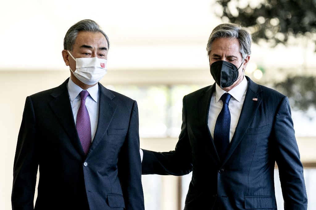 US Secretary of State Antony Blinken and Chinese Foreign Minister Wang Yi meet on the Indonesian island of Bali on 9 July 2022 (AFP)