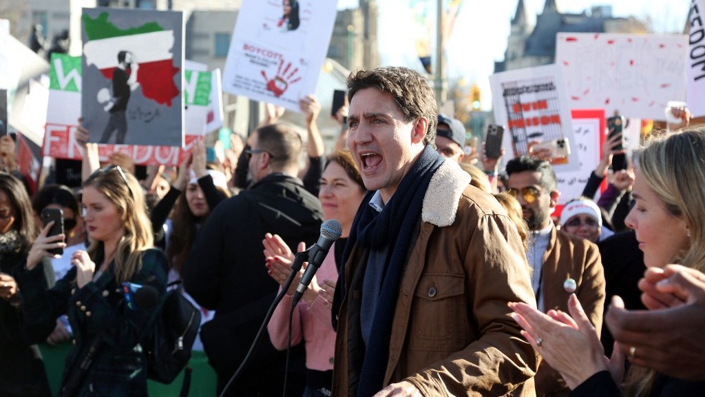Canadian Prime Minister Justin Trudeau speaks at a protest in Ottawa in support of Iranian women on 29 October 2022 (AFP)