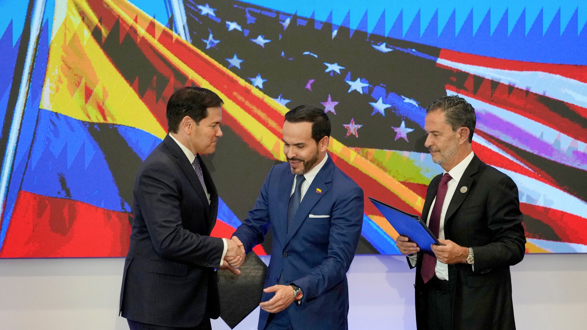 US Secretary of State Marco Rubio (L) and Colombia's President Abelardo de la Espriella (C) shake hands next to Colombia's Foreign Minister Omar Bula (R) during a bilateral agreements signing ceremony in Barranquilla, Colombia on September 8, 2026. Fernando Vergara / POOL / AFP