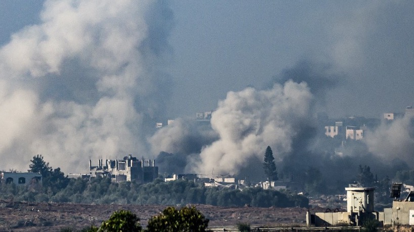 This picture taken from southern Israel near the border with the Gaza Strip shows smoke rising from buildings still after being hit by Israeli strikes in the battles between Israel and Hamas militants, on December 1, 2023