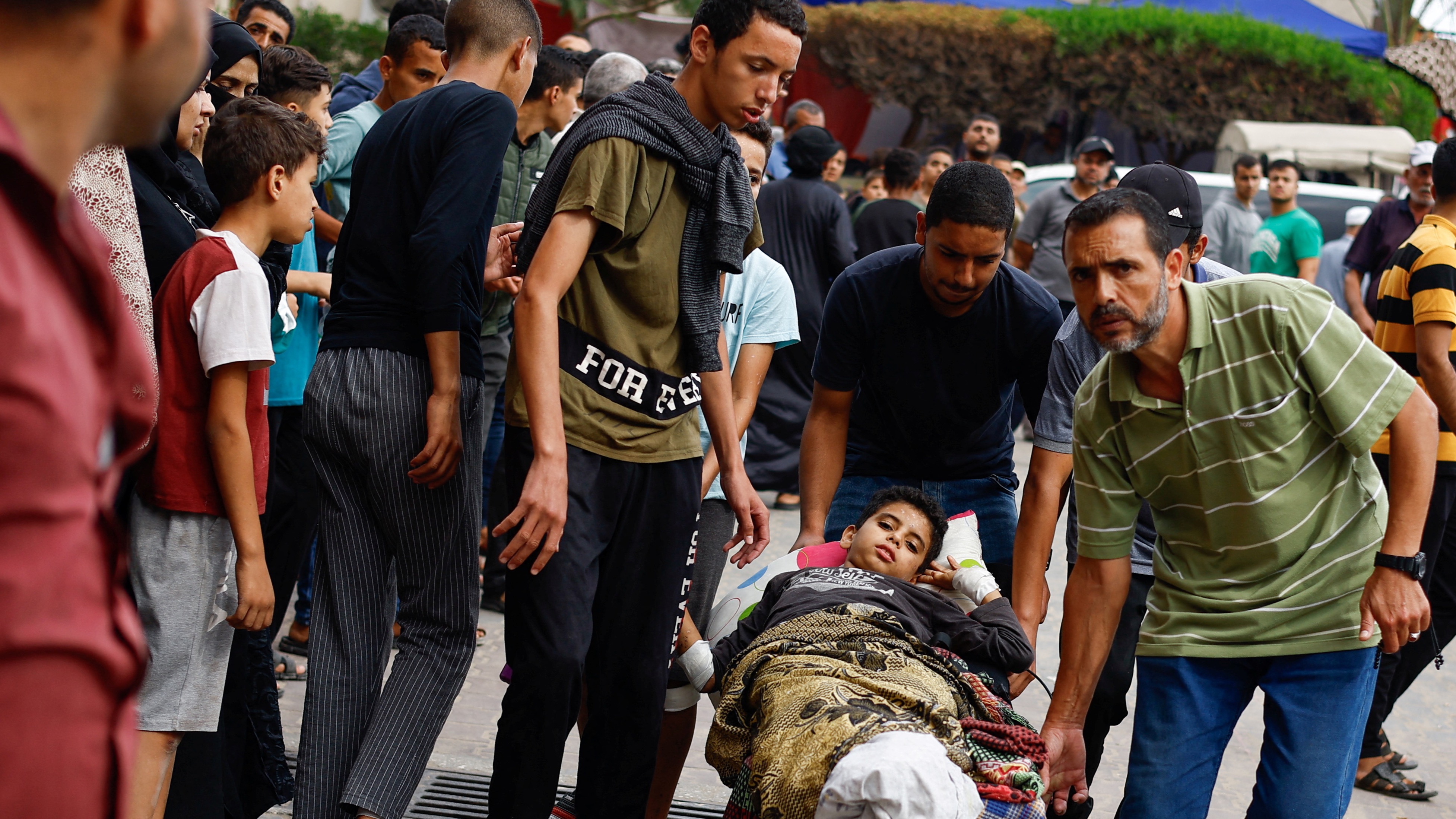 Injured Palestinians from the Khan Yunis strike are taken to medical facilities in the south of Gaza 
