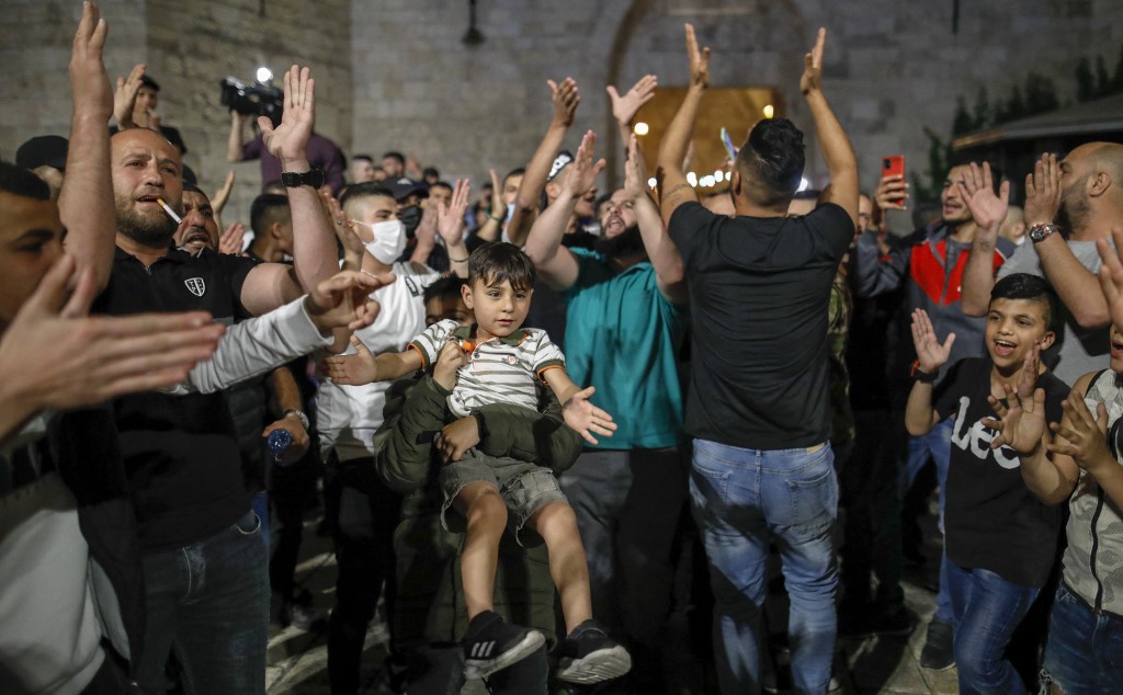 Palestinians protest at Jerusalem’s Damascus Gate on 25 April 2021 (AFP)