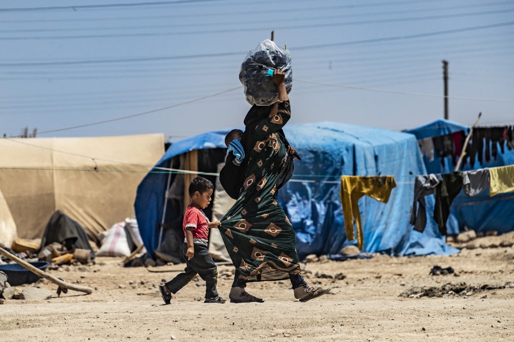Displaced Syrians are pictured in Hasakah province on 28 June 2021 (AFP)
