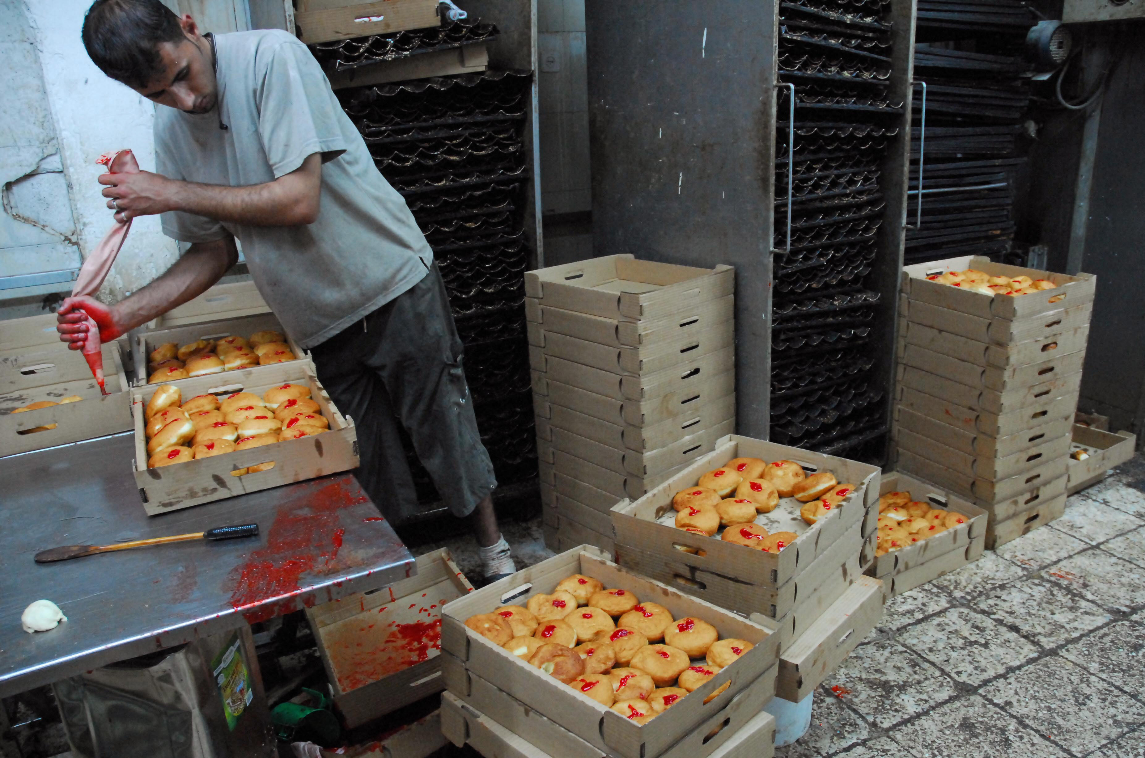 Sufaganiyot, deep fried doughnuts are a popular food during Hanukkah (AFP/Yahuda Raizner)