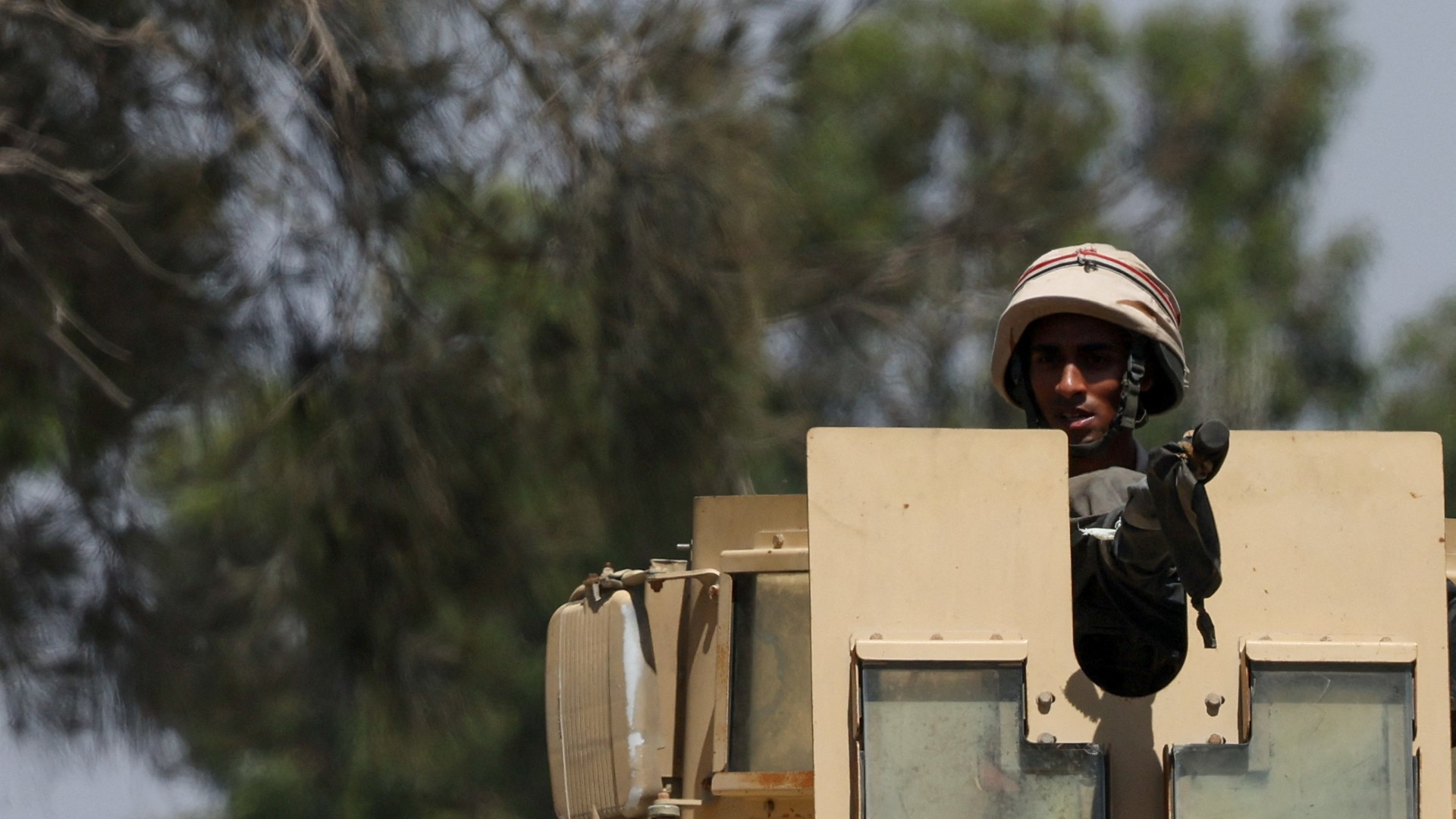 An Egyptian soldier looks on from a vehicle near the Rafah border crossing between Egypt and the Gaza Strip, in Rafah, Egypt, 6 August 2025 (Reuters/Amr Abdallah Dalsh)