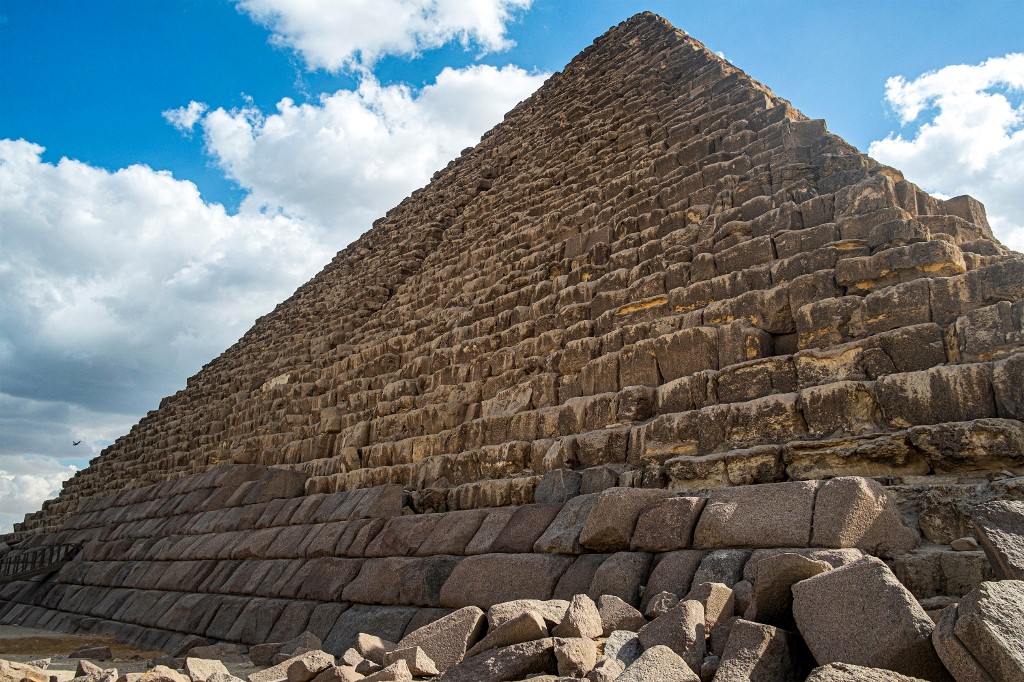 A stone is lifted by a crane during a conservation project by the base of the Pyramid of Menkaure (or Menkheres, built in the 26th century BC) at the Giza Pyramids Necropolis, west of Cairo, on January 29, 2024.