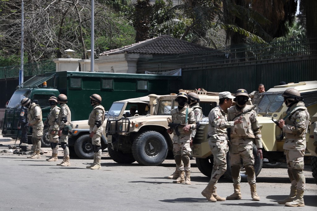 Egyptian soldiers stand guard in Cairo ahead of the 2018 presidential election (AFP)