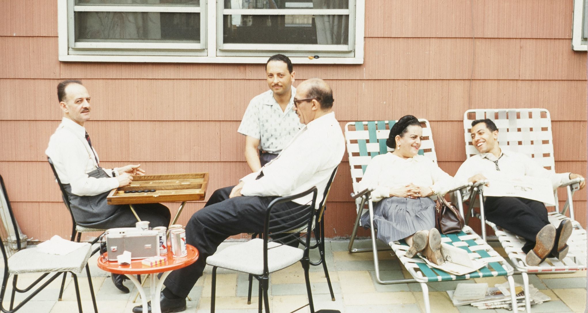 From Left to Right: Youssef Sidhom, Dr. Sami Boulos, Dr. Maher Kamel, Mrs. Eva El Masry Sidhom, Dr. Elhamy Khalil. In the yard at Dr. Kamel's house in Elizabeth, N.J, 1960 (credit)
