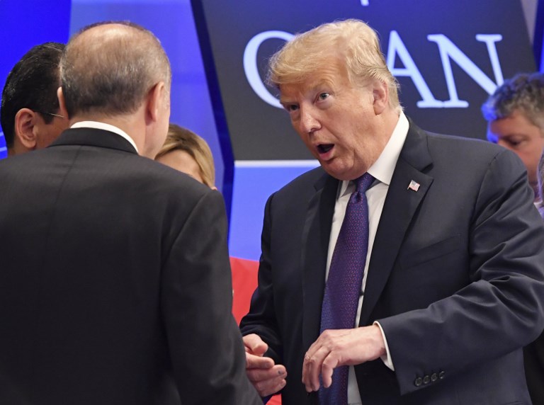 US President Donald Trump talks to Turkish President Recep Tayyip Erdogan in Brussels in July 2018 (AFP)