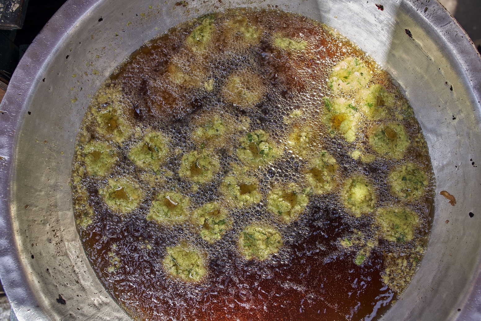 Sayed El Deeb, a vendor on Abd Al Aziz Gaweash street, whose family has been making taameya (falafel) for 50 years, in downtown Cairo, 10 April 2019 (MEE/Hamada Elrasam)