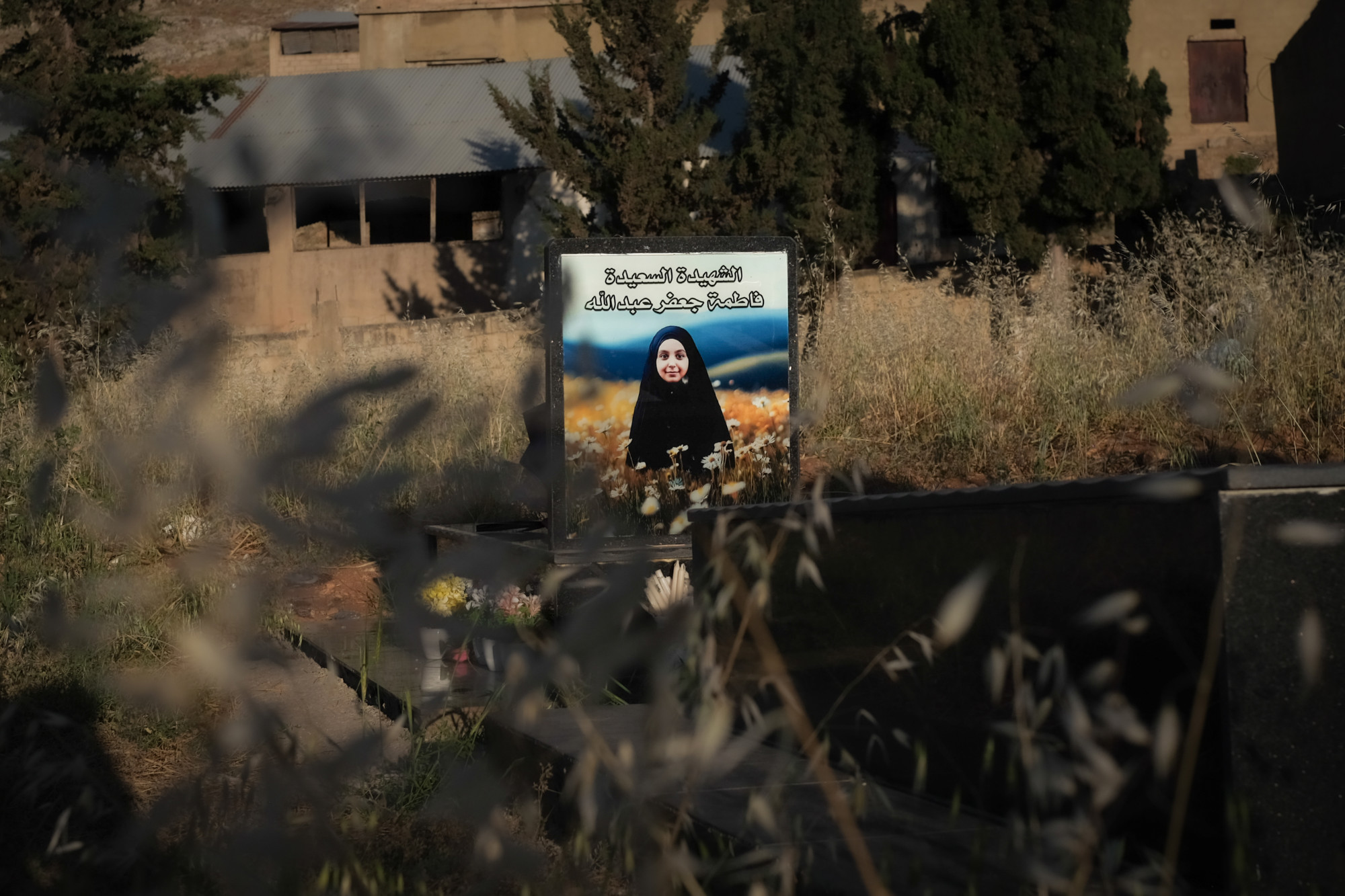 The tomb of Fatima Abdallah, 9, killed by a pager's explosion while sitting alone in her kitchen (João Sousa/MEE)