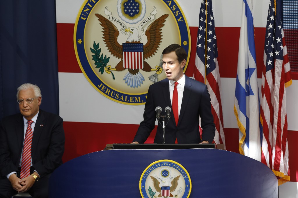 The US ambassador to Israel, David Friedman, listens as White House adviser Jared Kushner speaks in Jerusalem in May 2018 (AFP)