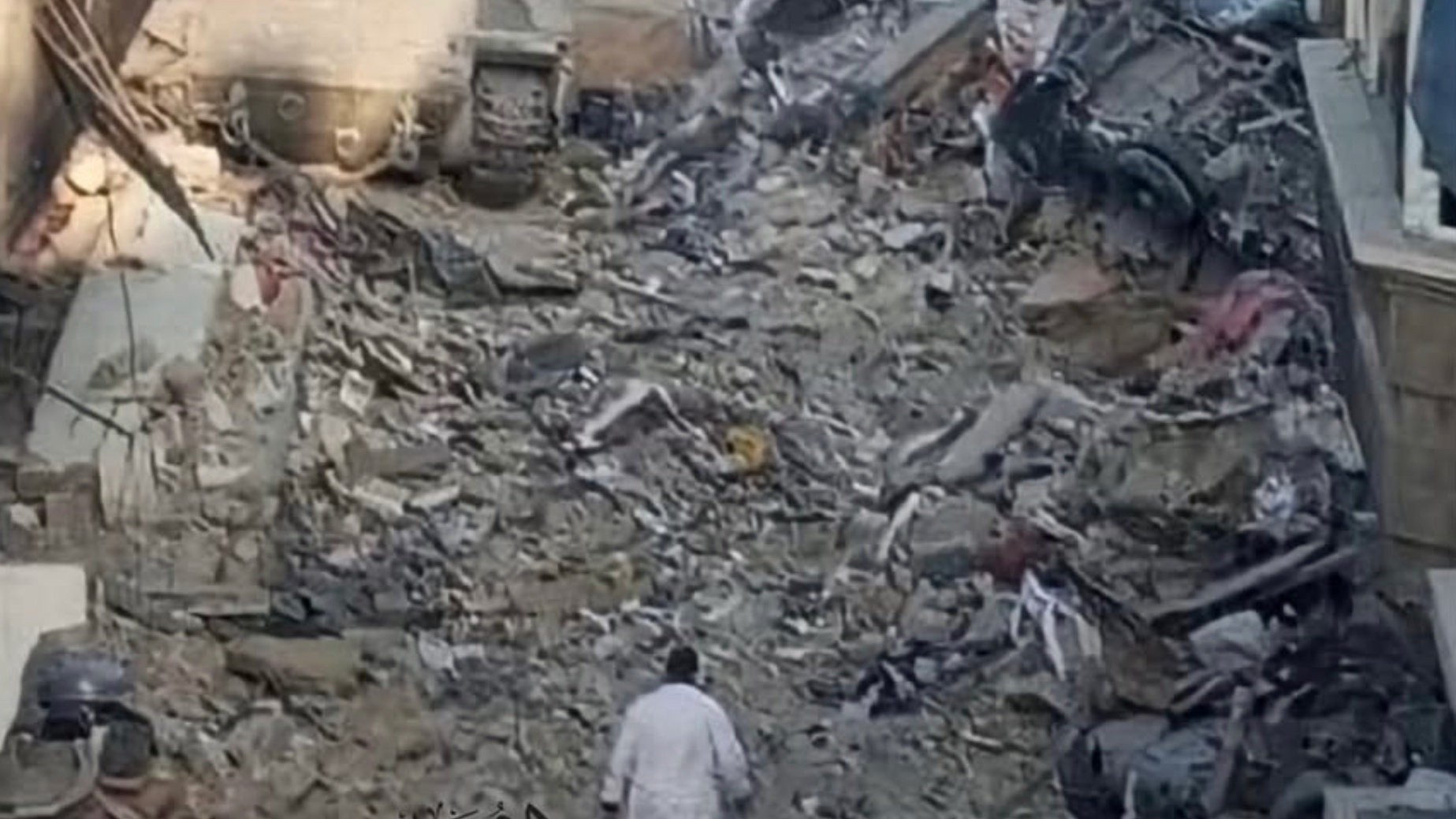 The last known image of Dr Hussam Abu Safiya shows him walking in a white lab coat towards Israeli tanks (Screenshot/Social media)