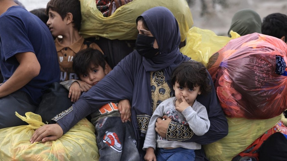 Palestinians arrive south of Gaza City on 12 November 2023, after fleeing their homes in Gaza City and the Northern Gaza Strip amid the ongoing battles between Israel and Hamas (AFP)