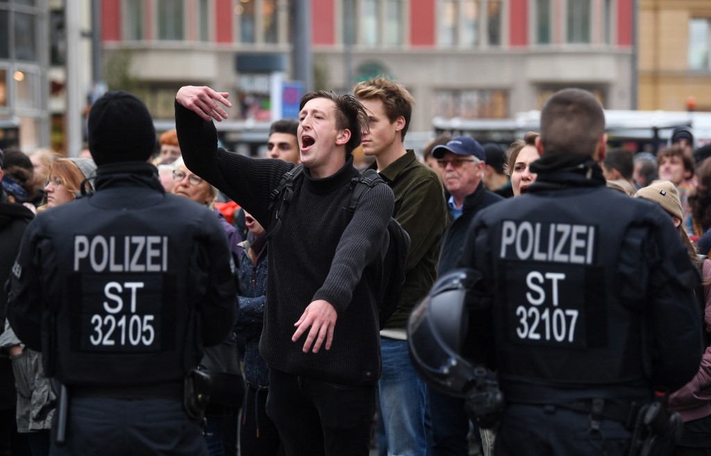 People protest against a far-right speaker in Halle, Germany, on 11 October (AFP)