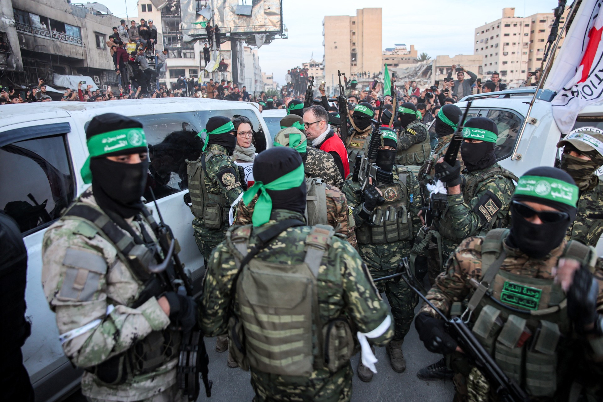 hamas fighters with red cross workers