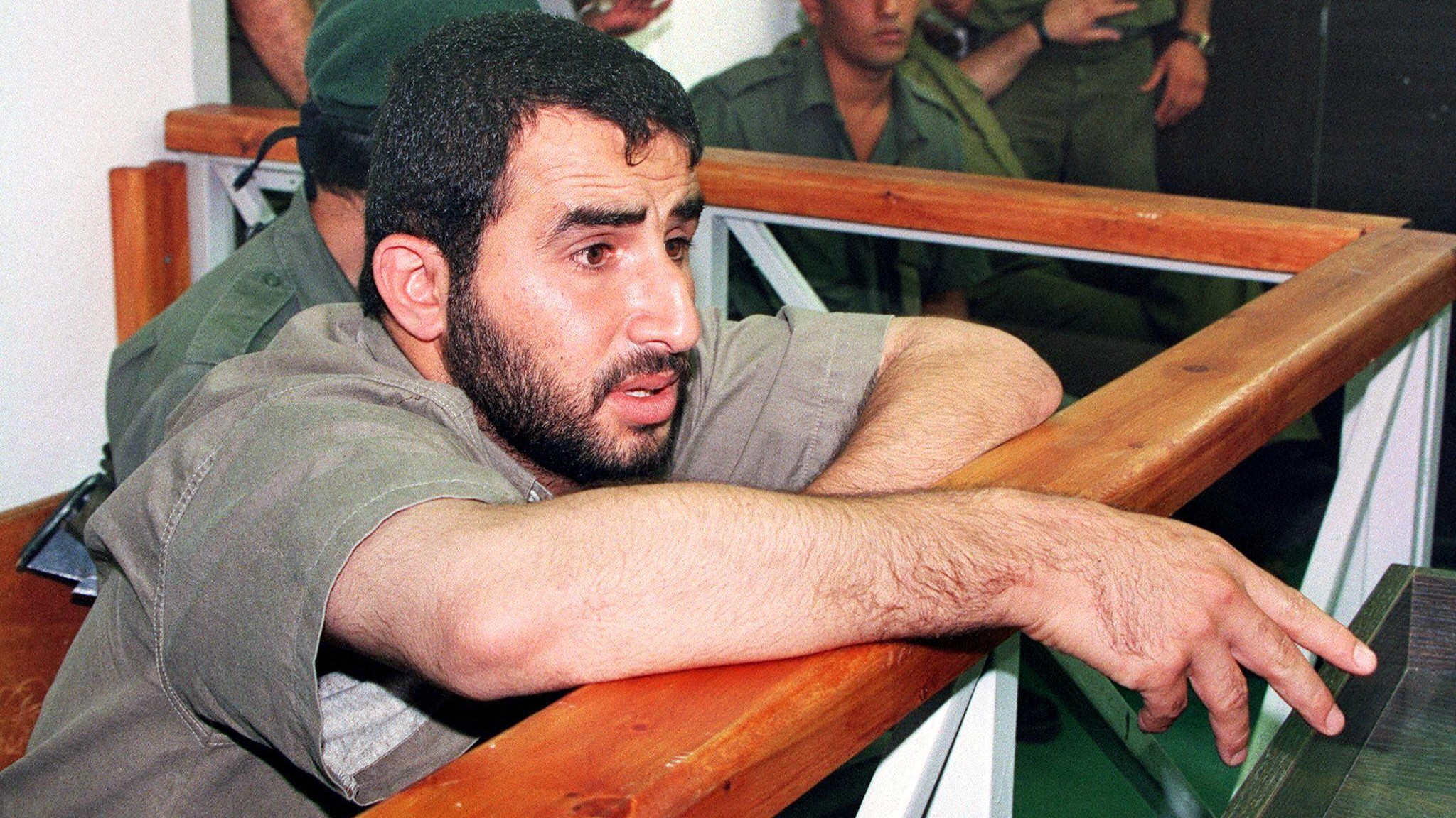 Hassan Salameh sits at the Israeli military court before his verdict on 7 July 1997 in Beit El in the occupied West Bank (Menahem Kahana/AFP)