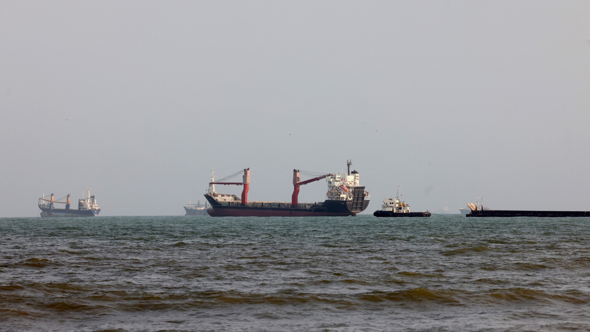Vessels are seen in the Strait of Hormuz, off the port city of Bandar Abbas in southern Iran on 10 August 2026 (Atta Kenare/AFP)