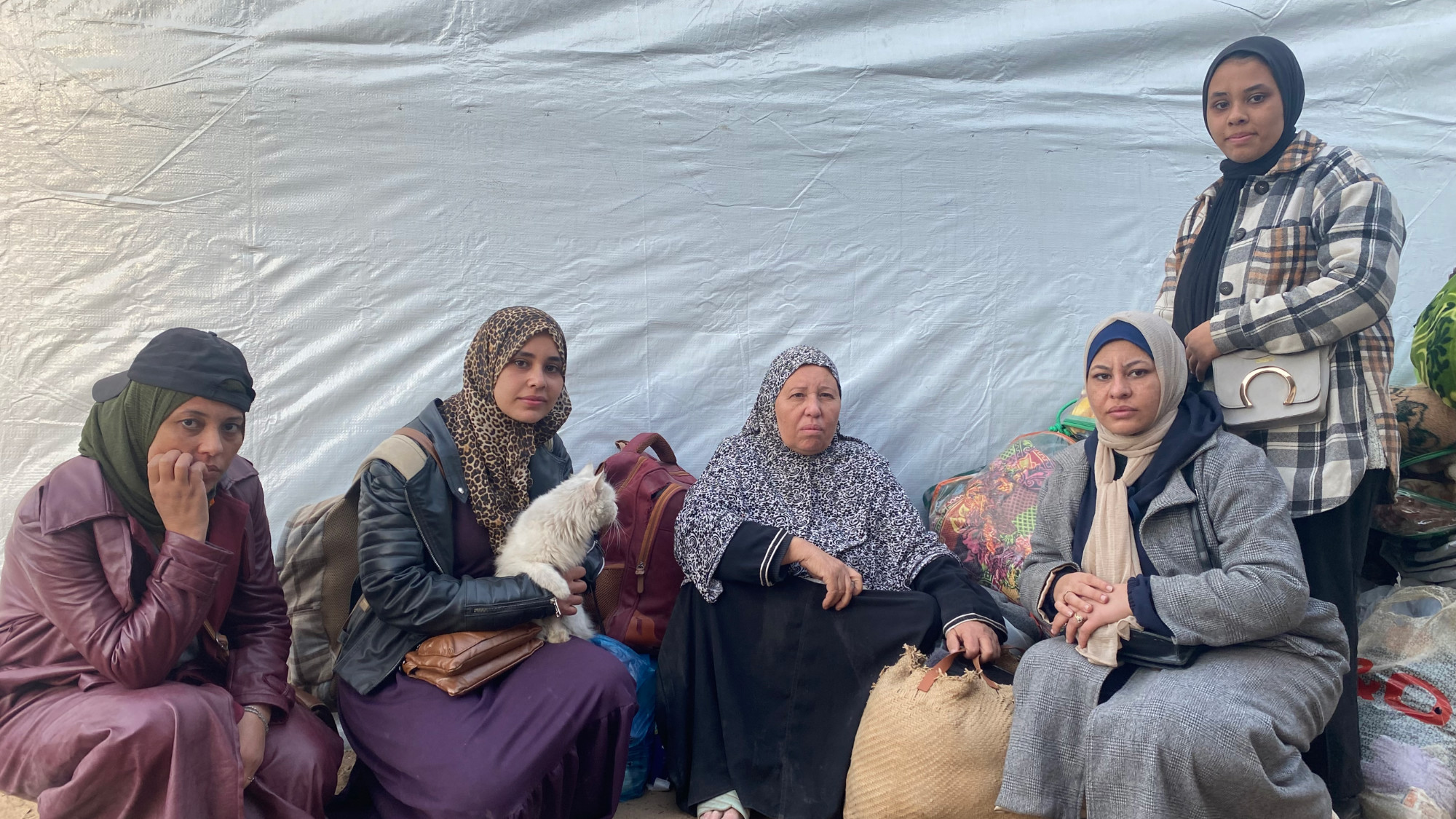 Howaida Kilani (centre) with her four deaf daughters pictured in Gaza City (MEE/Ahmed Dremly)