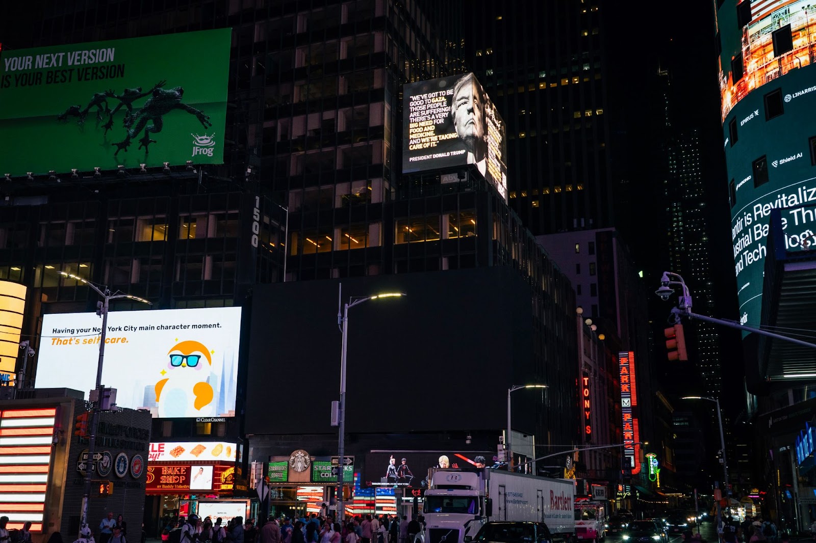 A billboard erected by the ADC in Times Square on 12 May 2025 shows President Donald Trump's face and a demand that he allow unconditional aid into Gaza, based on his own pledge to help.
