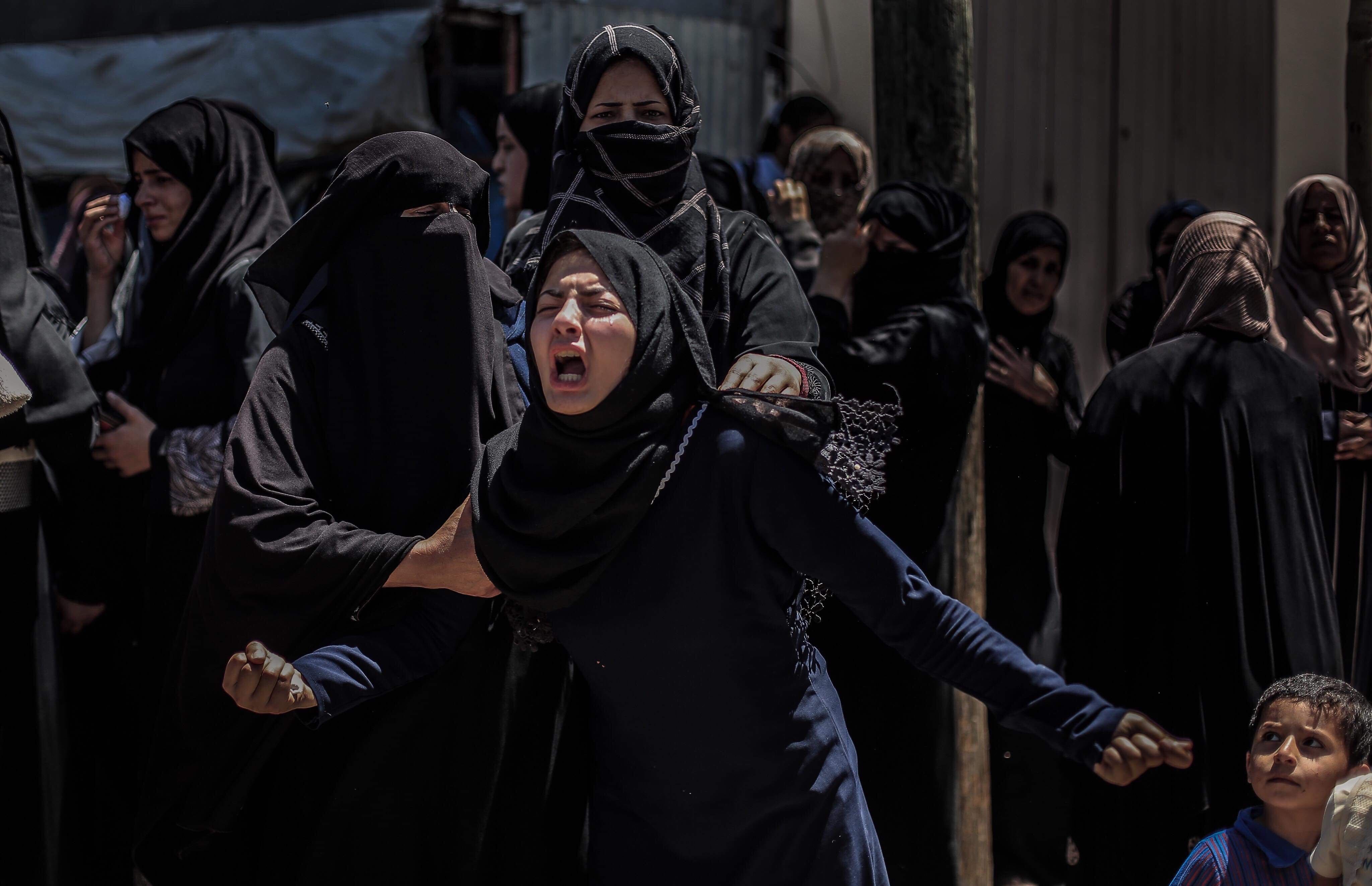 Yasmina, sister of slain 19-year-old Raed Khalil Abu Tair, at her brother's funeral in Gaza's Khan Yunis on Saturday (MEE/Sanad Abu Latifa)