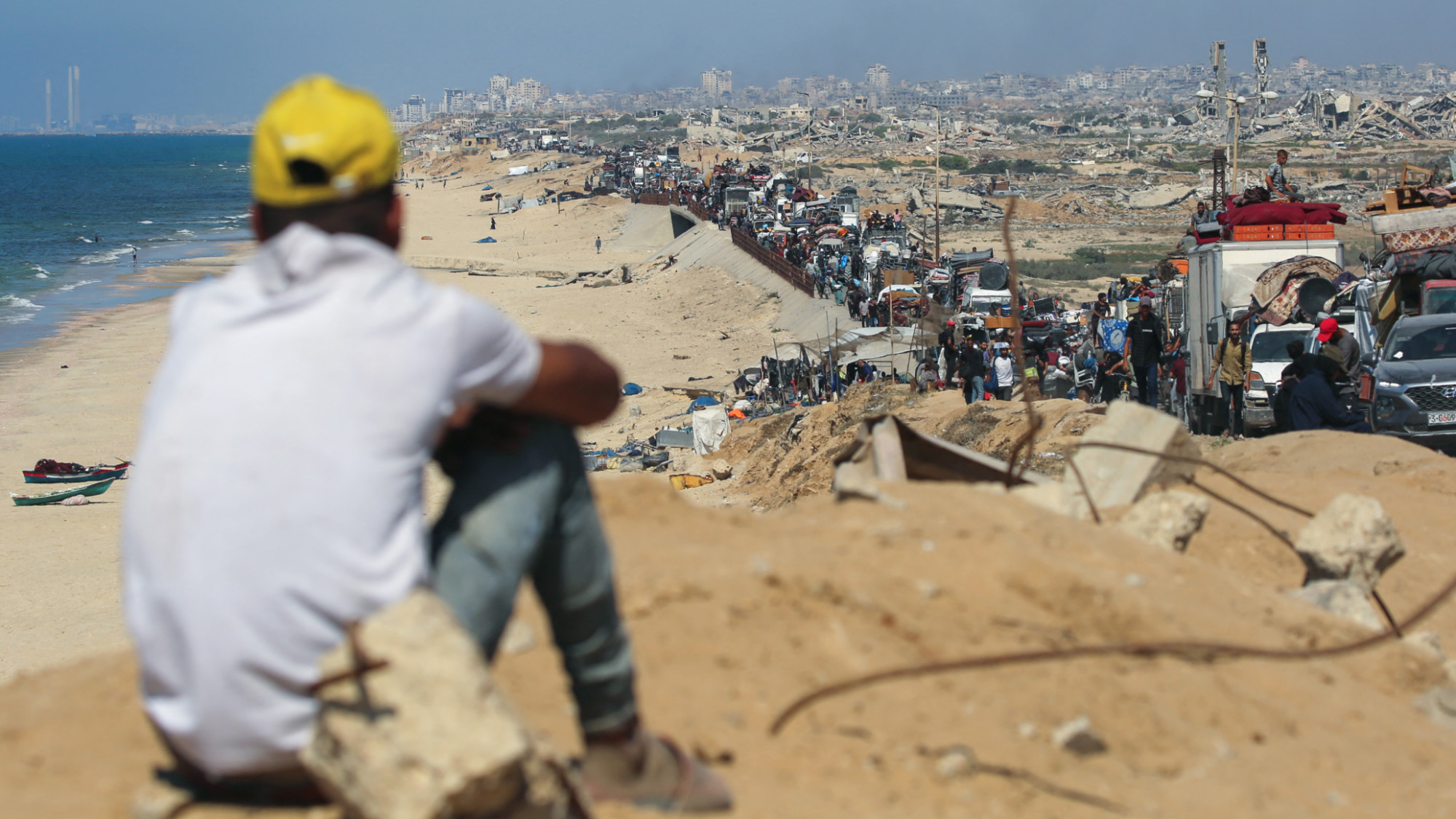 Displaced Palestinians move towards the Nuseirat refugee camp area in the central Gaza Strip after being forced out of Gaza City on 14 September 2025 (AFP/Eyad Baba)