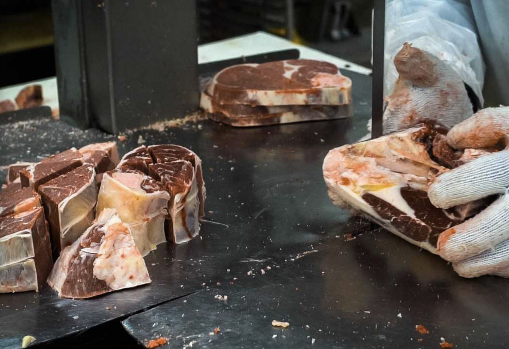 An employee handles cuts at Saad Wholesale Meats (Supplied)