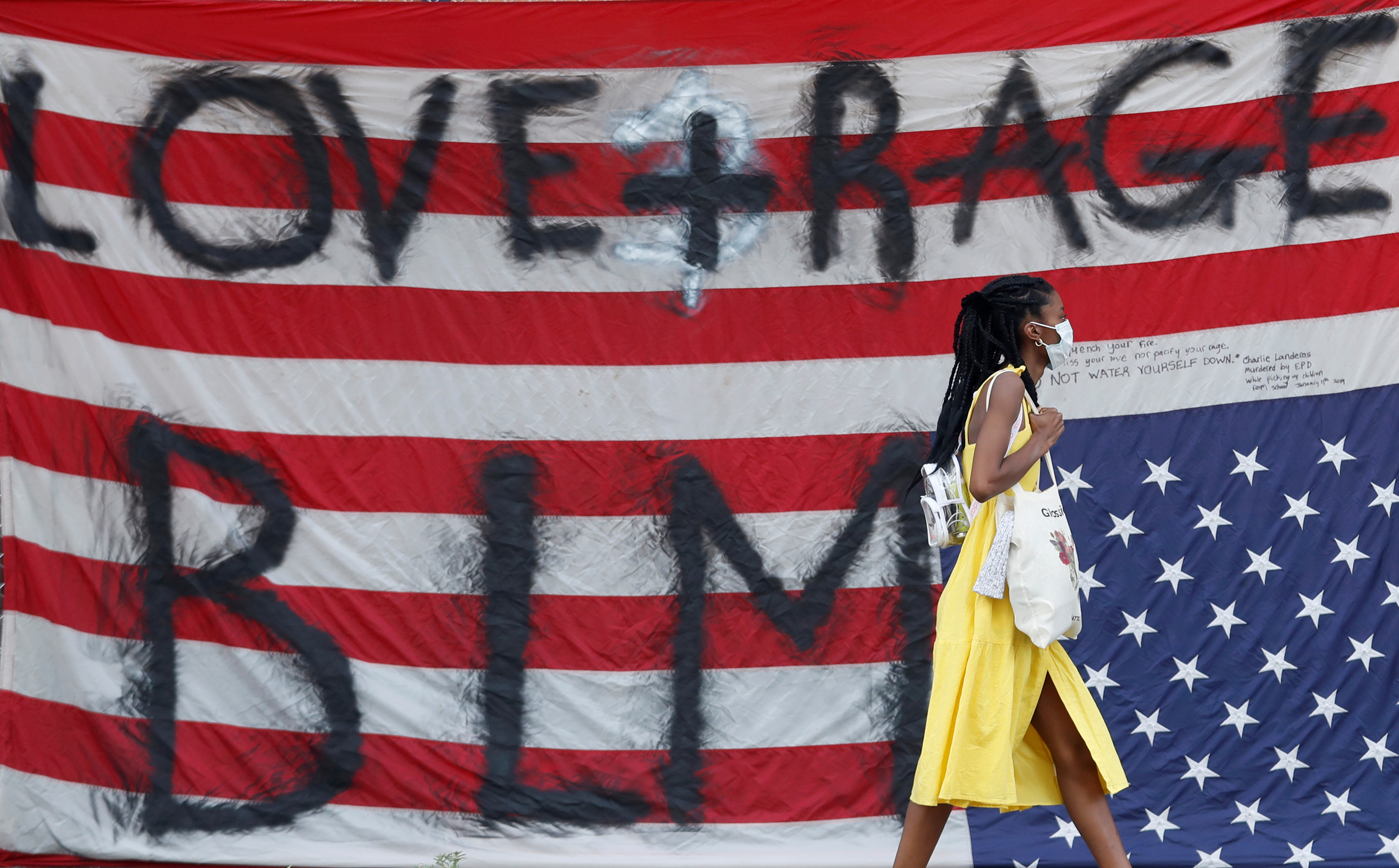 A demonstrator walks by in Seattle's protest zone (Reuters)