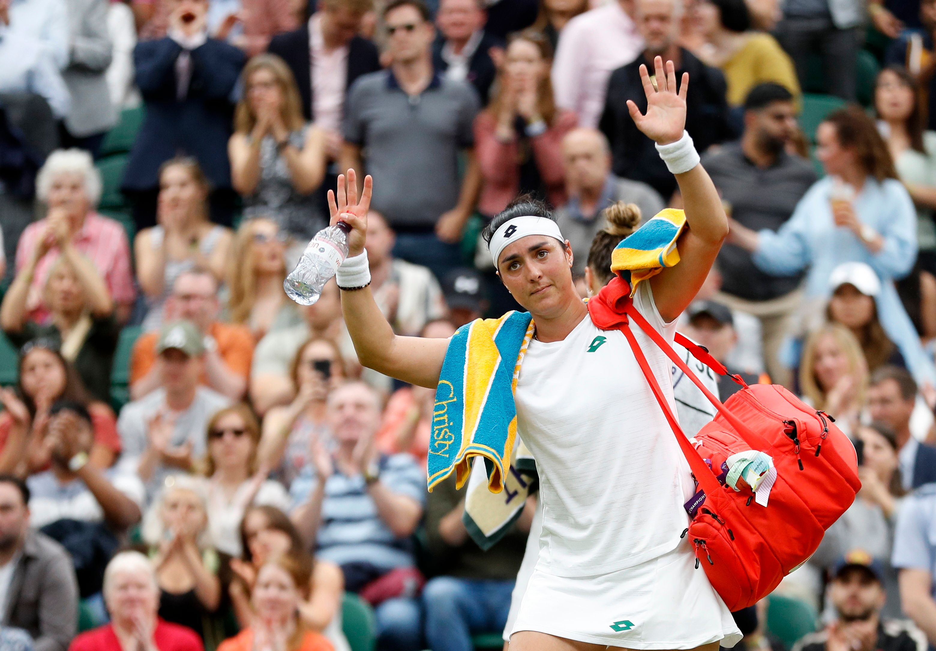 Tunisia's Ons Jabeur looks dejected as she walks off the court after losing her quarter final match against Belarus' Aryna Sabalenka (Reuters)