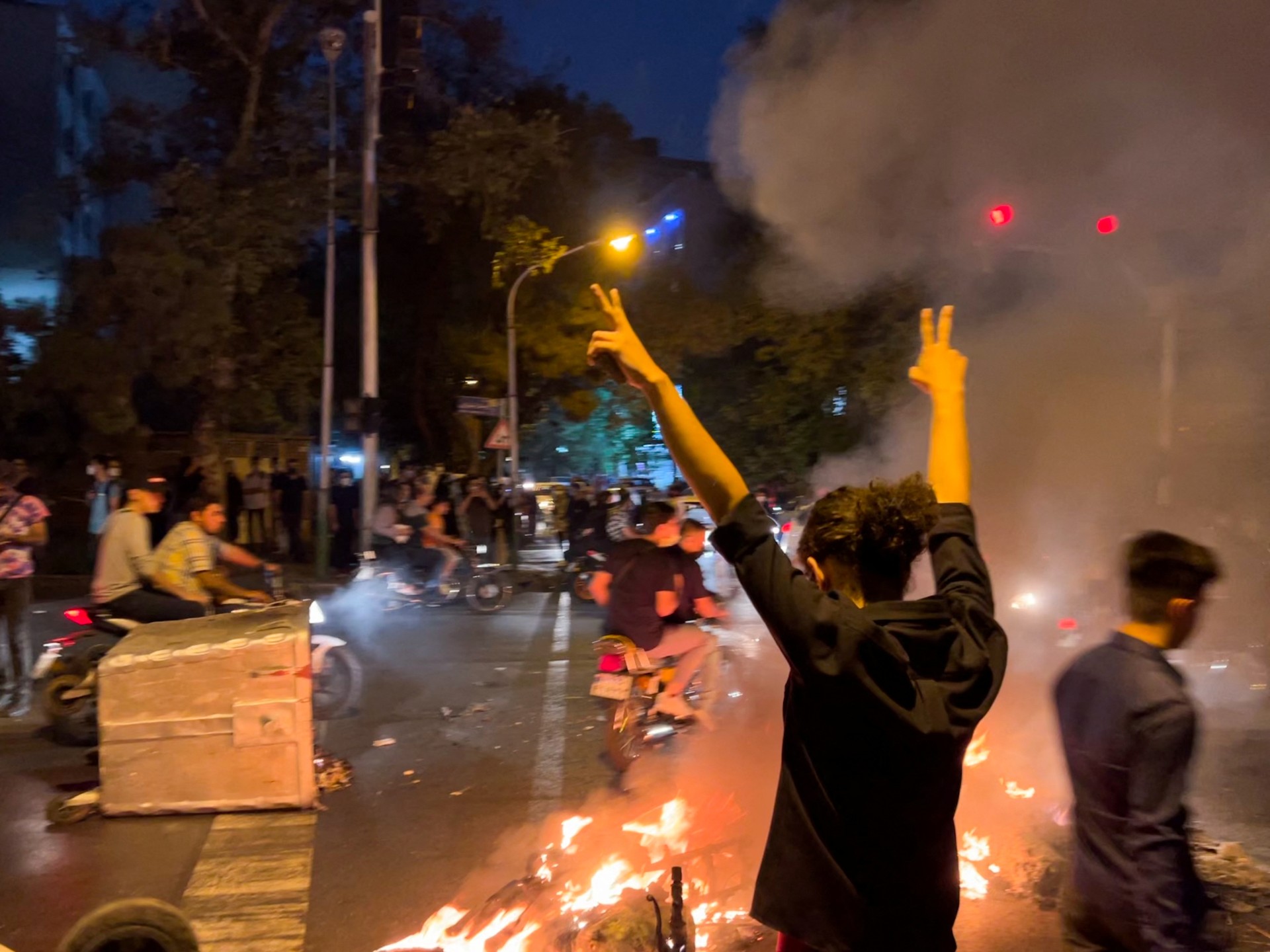 A man gestures during a protest over the death of Mahsa Amini in Tehran, on 19 September 2022 (Reuters)