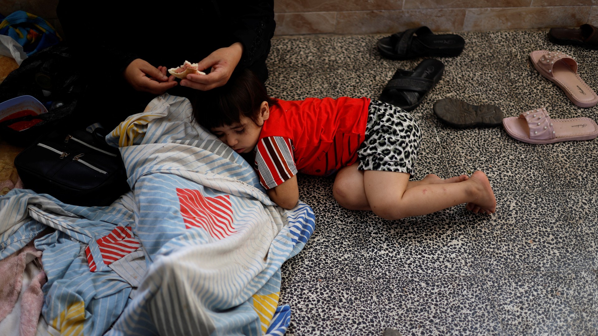 Palestinians shelter at a United Nations-run school in Khan Younis (Reuters)