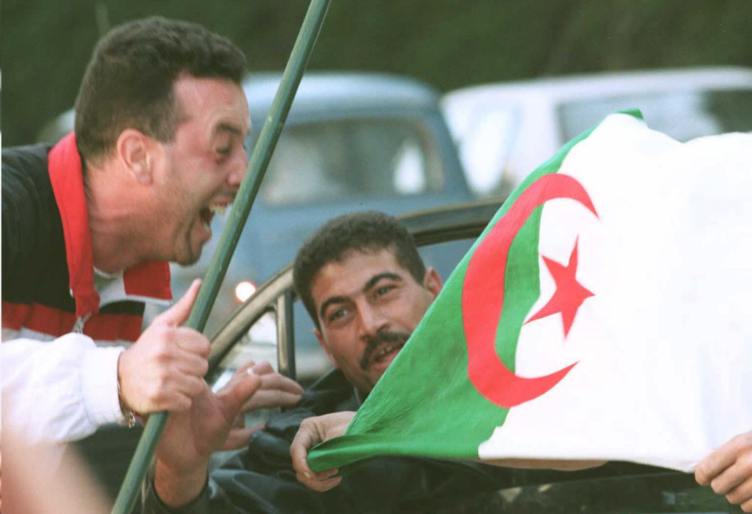 Algerians celebrate in Algiers in November 1995 after Liamine Zeroual won the country's first free presidential election (AFP)