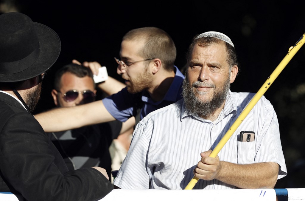 Lehava leader Bentzi Gopstein takes part in a protest against the Gay Pride parade in Jerusalem on 21 July 2016 (AFP)