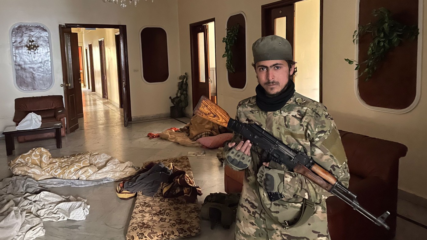 Syrian rebel fighter Abu Jassim pictured at a Damascus palace used by Russian diplomats on 12 December 2024 (Daniel Hilton/MEE)