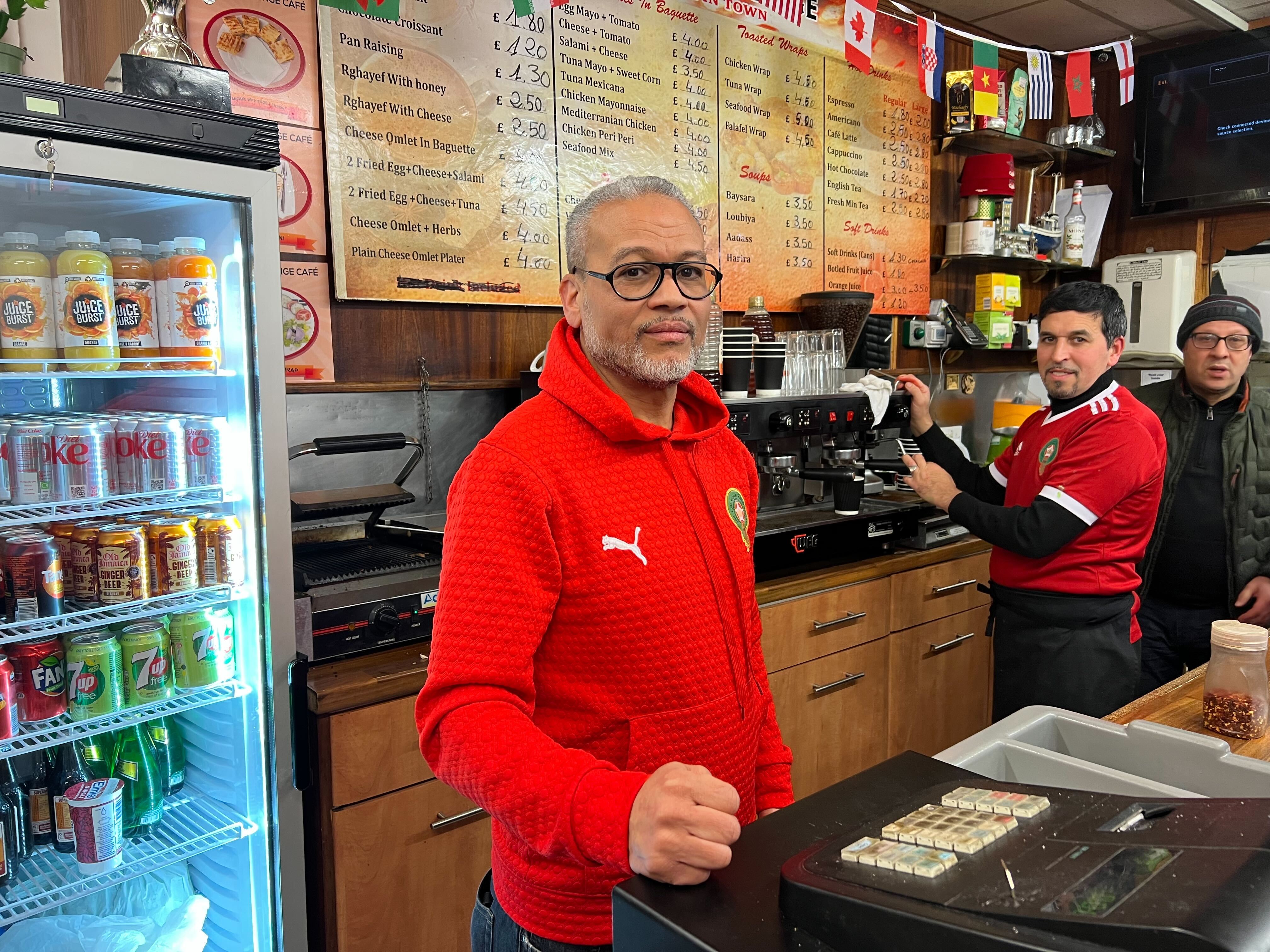 Abdesalame serves customers in the Trellick lounge on Golborne Road in West London (MEE/Areeb Ullah)