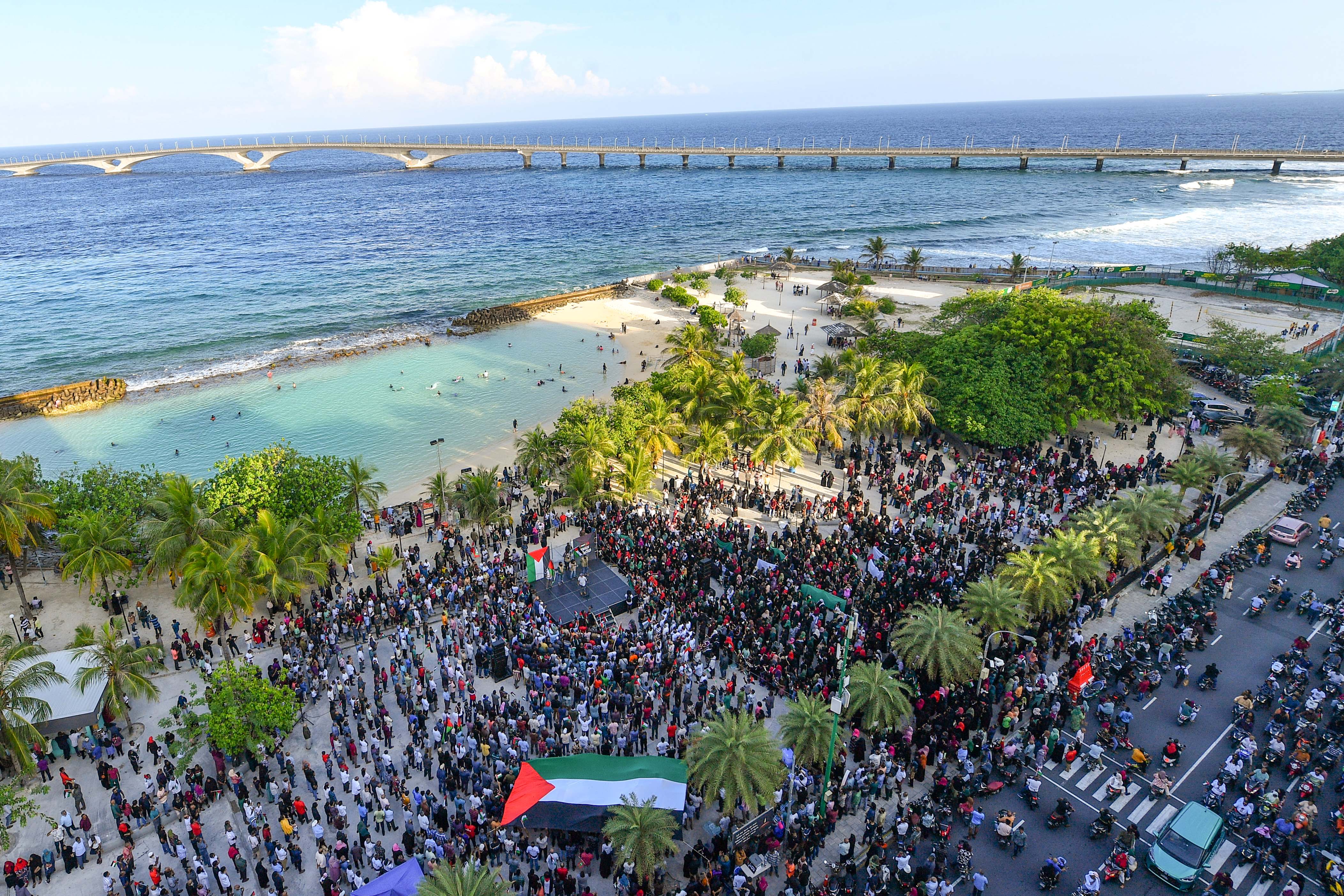 Demonstrators gather to show solidarity with Palestinians during a rally held in the artificial beach region in the capital city of Male on 14 October (AFP/Mohamed Afrah)