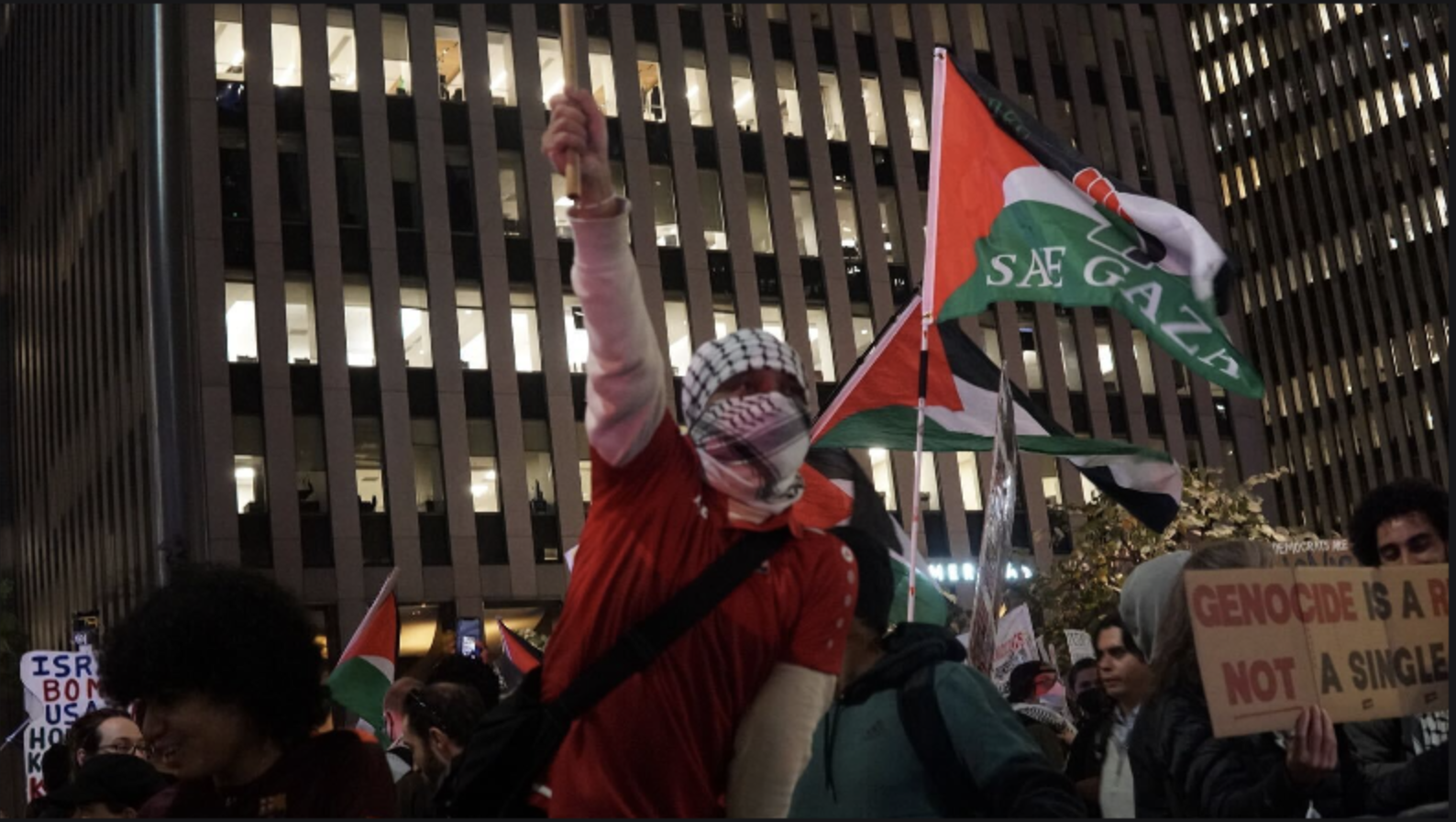 Activists demonstrating in support of Palestinians in Gaza march in Midtown Manhattan on US presidential election night, on 5 November 2024, in New York City (Azad Essa/MEE)