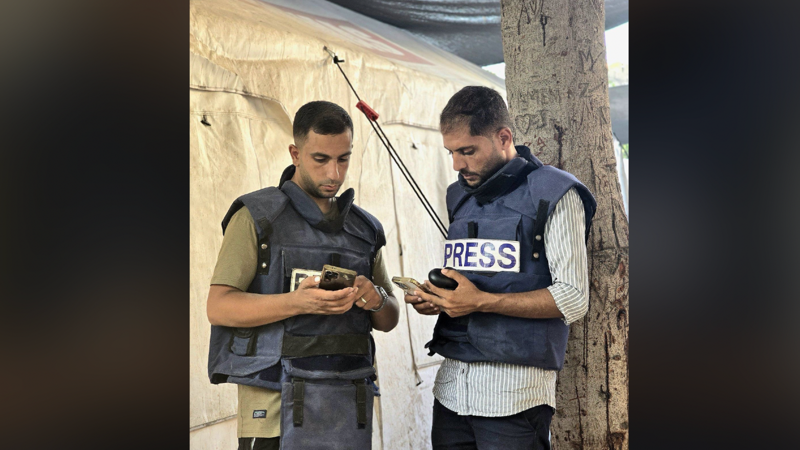Al Jazeera correspondents Mohammed Qraiqea (L) and Anas al Sharif (R)