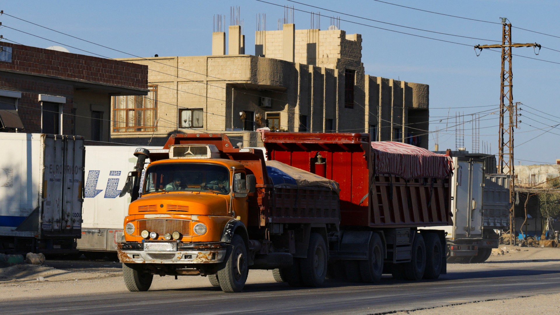 The type of Mercedes truck that carried thousands of bodies from the Qutayfah mass grave to a secret desert site created by the Assad government, near the town of Dhumair (Khalil Ashawi/Reuters)