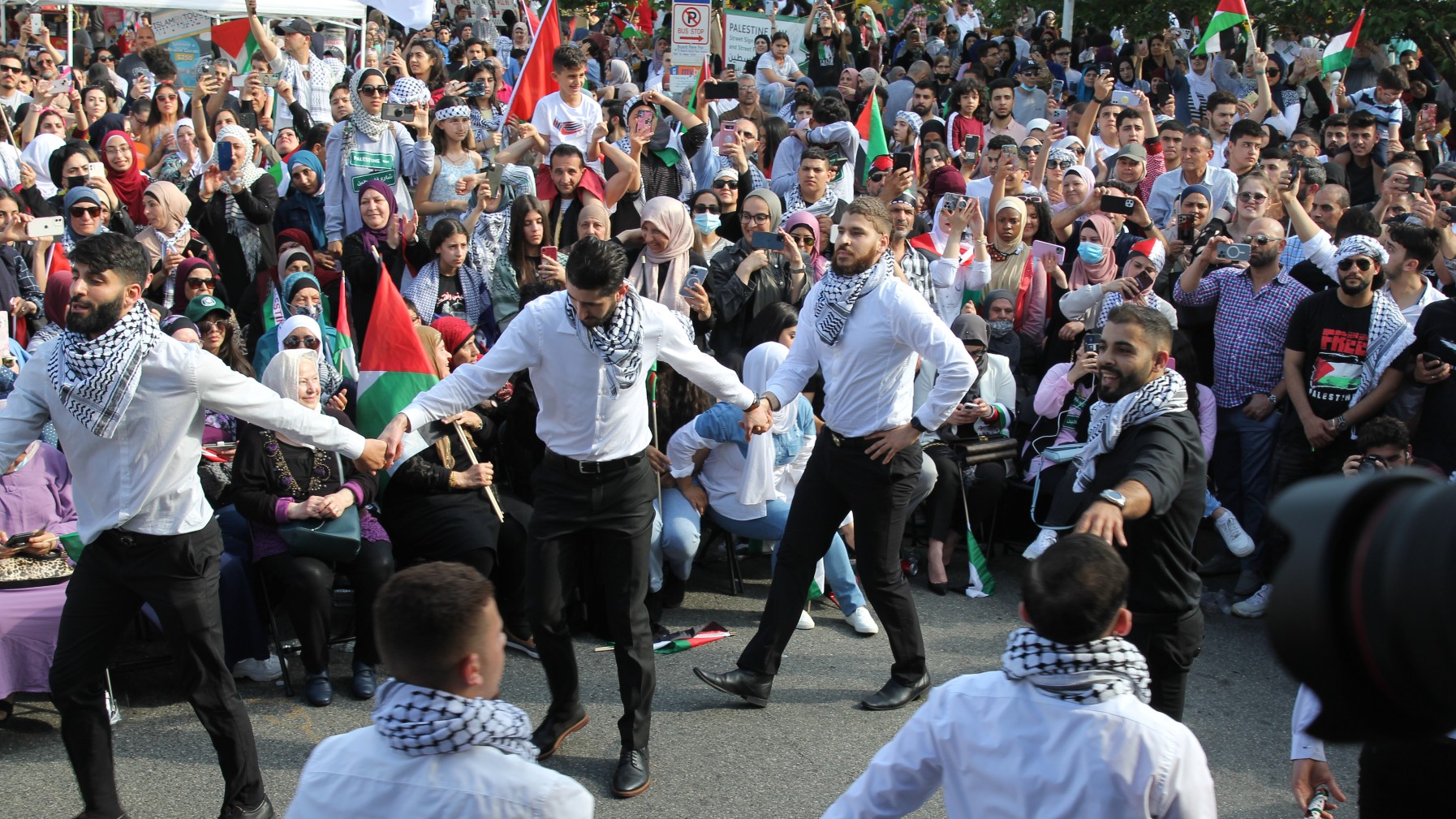 The Baydar Dabka group of Palestinian American dabka dancers perform for attendees (MEE/Reem Farhat)