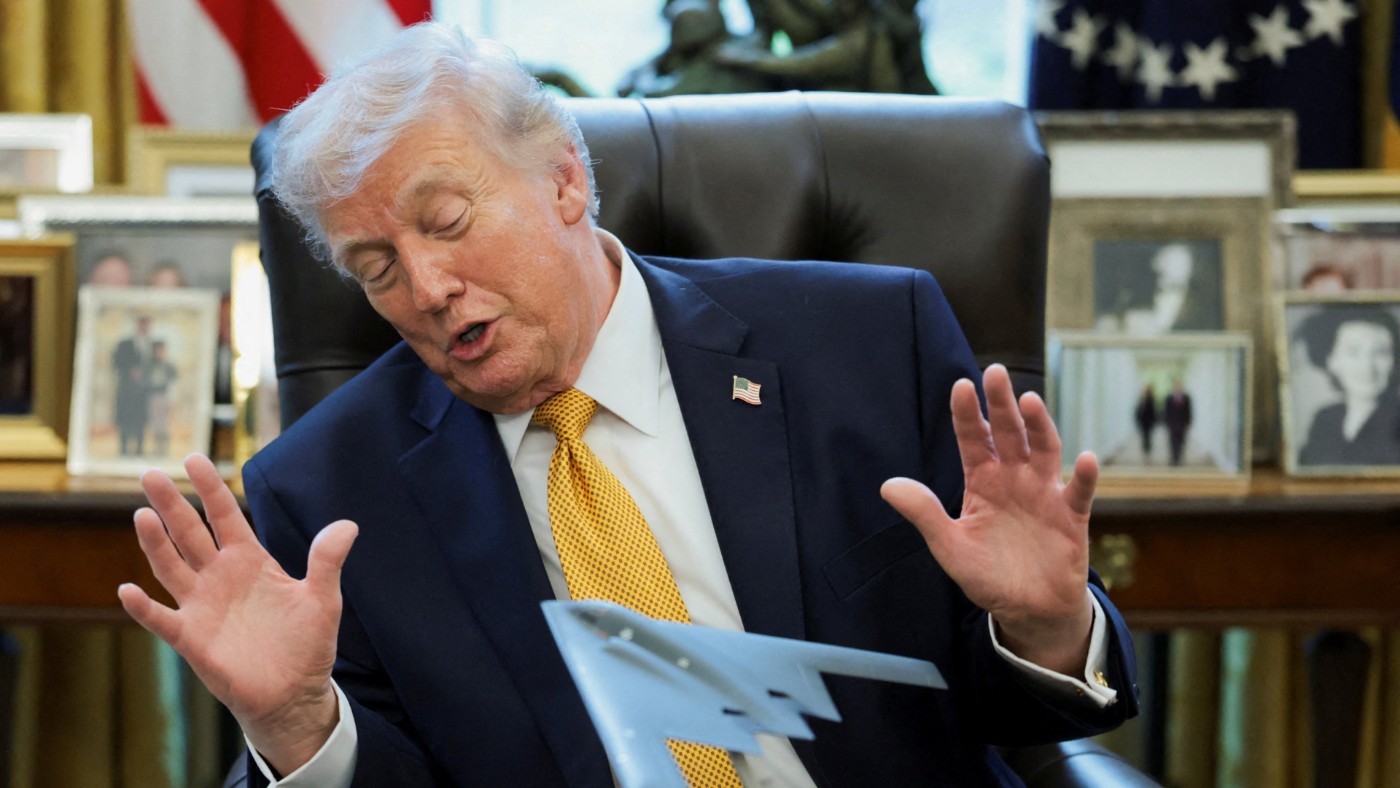 US President Donald Trump looks at a model of a B‑2 bomber at the White House in Washington, DC, 16 March 2026 (Jonathan Ernst/Reuters